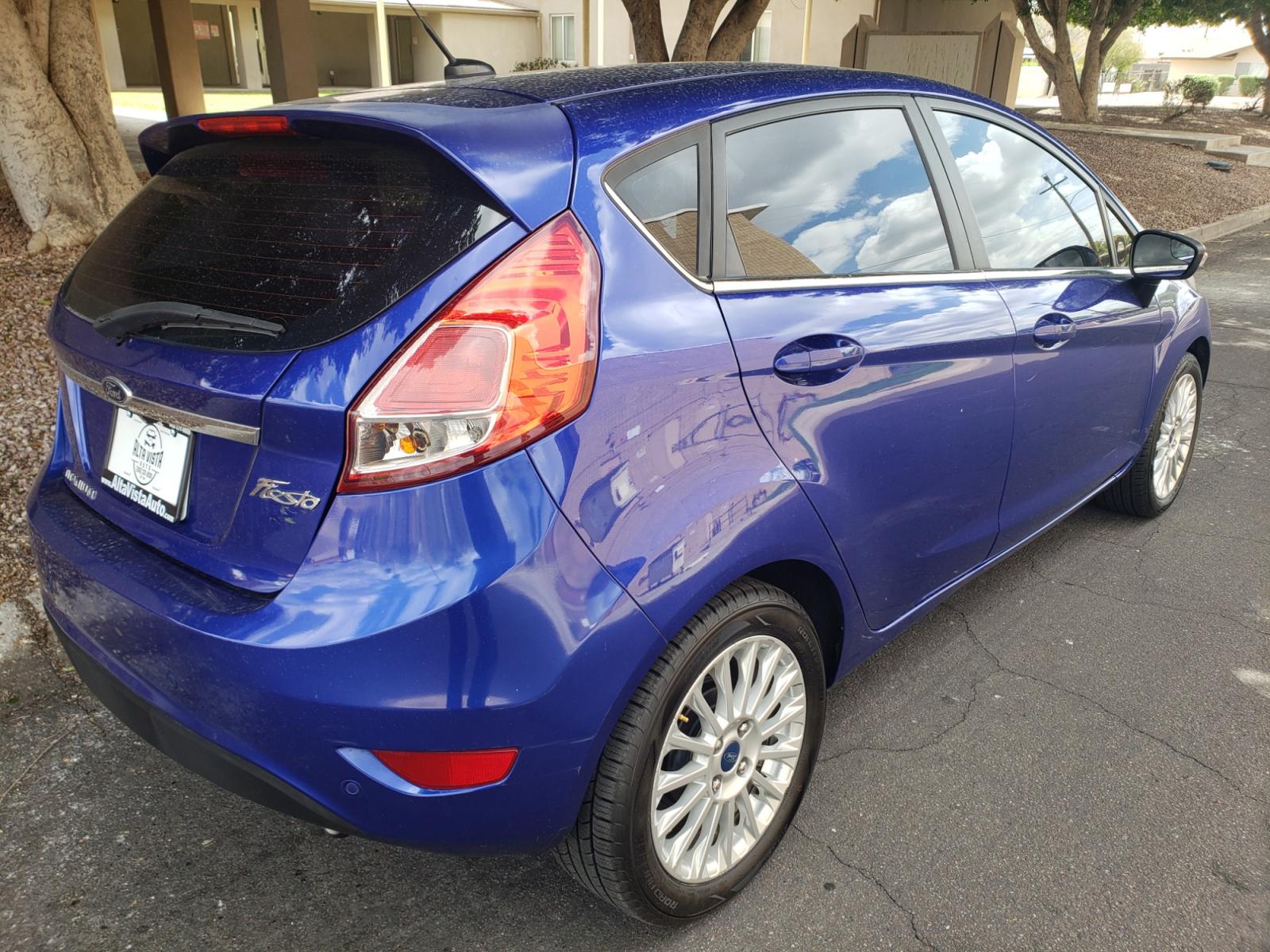 2014 /Tan and black Ford Fiesta Titanium (3FADP4FJ5EM) with an 1.6l i4 engine, 6-Speed Automatic transmission, located at 323 E Dunlap Ave., Phoenix, AZ, 85020, (602) 331-9000, 33.567677, -112.069000 - 2014 Ford Fiesta Titanium,.......A Must See!!... No accidents, Only 95K MILES.... Ice cold AC. The car is gorgeous inside and out. Power windows, Power door locks, Touch screen Stereo/ CD Player, Phone sync, Bluetooth, Satellite compatible, Backup camera, Beautiful tan and black interior with tan le - Photo #3